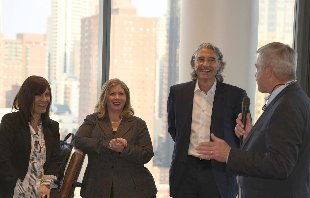 People celebrating the Niche 905 apartment grand opening